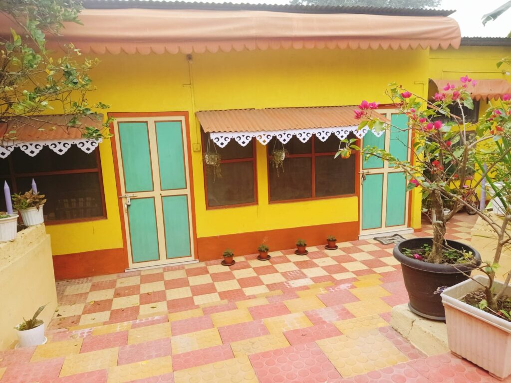 Front view of Goswami Eco Homestay Tezpur surrounded by peaceful greenery