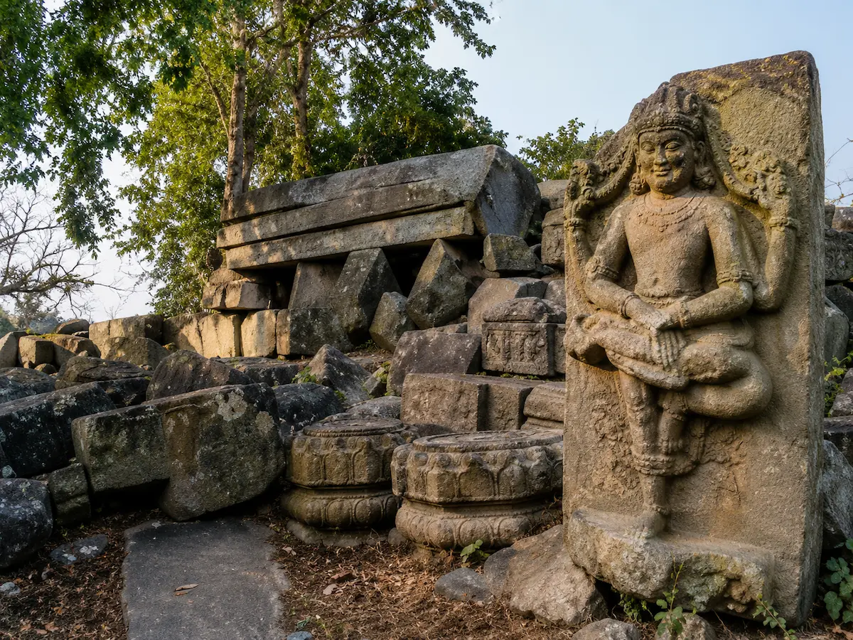 Ancient stone sculptures and archaeological ruins at Bamuni Hills near Goswami Eco Homestay, Tezpur.